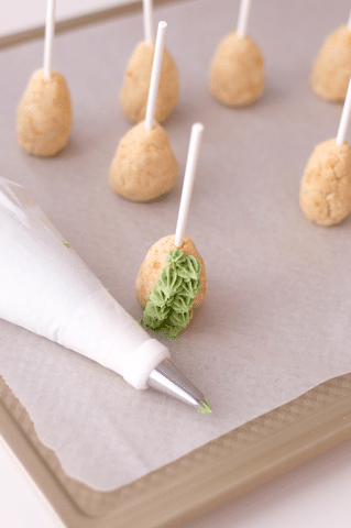 cone shaped cake pops, piping bag, green icing