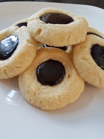 thumbprint cookies on white plate