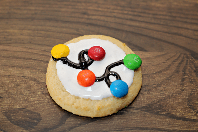 sugar cookies with white icing, gel icing and m&ms