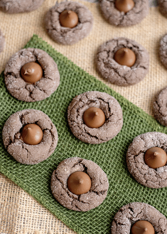 chocolate cake mix cookies with hershey kiss on green tray