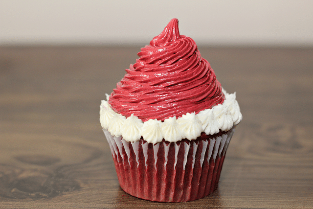 red velvet cupcakes with white icing, red icing 