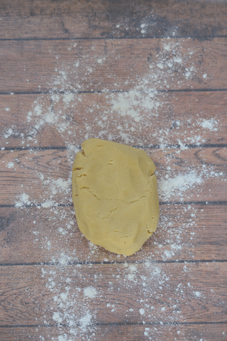 sugar cookie dough on floured surface