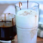 hershey chocolate syrup drizzling in glass of milk