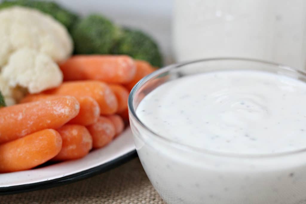 close up of homemade ranch with vegetables