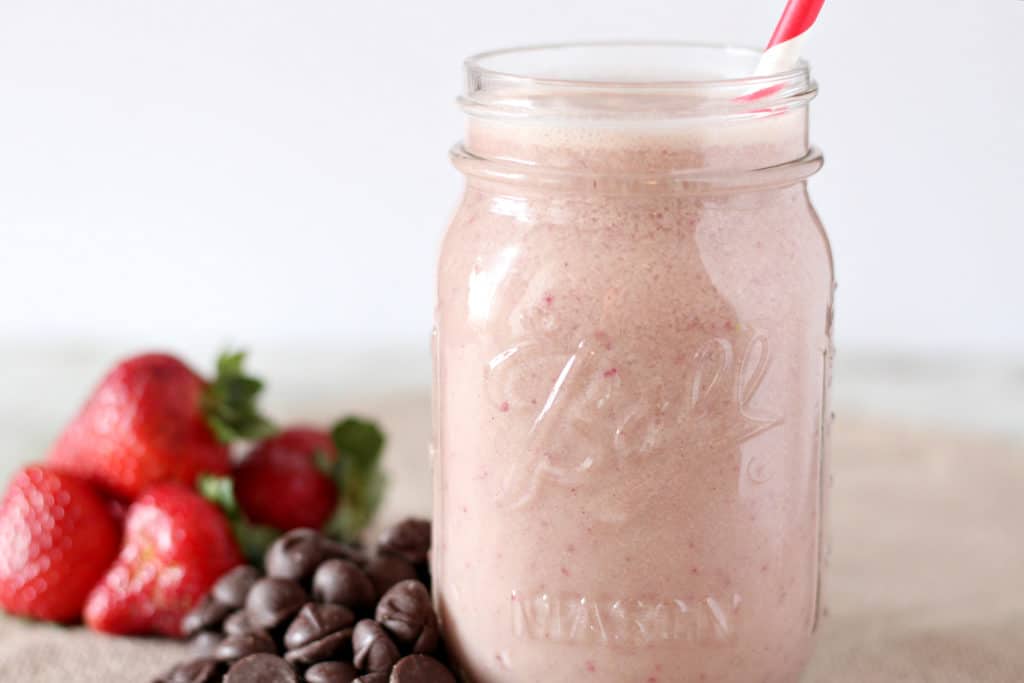 strawberry smoothie in a mason jar