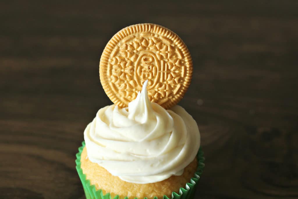 Add the oreo on top of the St. Patrick's Day cupcake