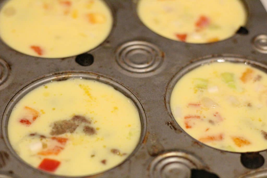 filled muffin tin with eggs