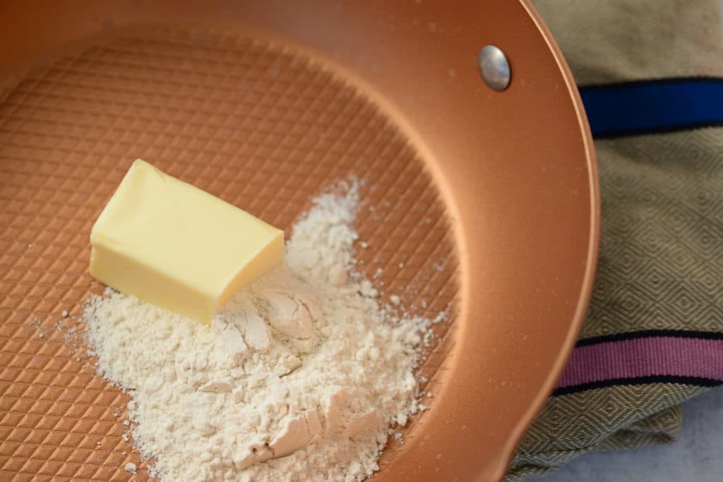 butter and flour in pan