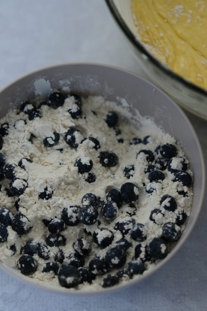 dredge blueberries in flour