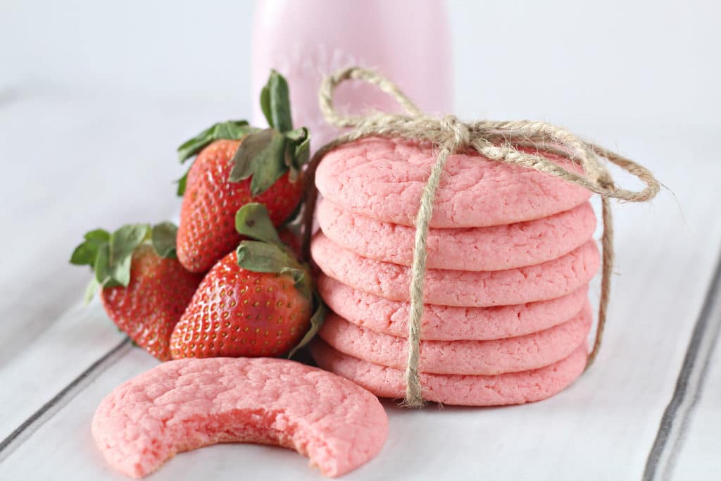 strawberry cookies with a bite in it