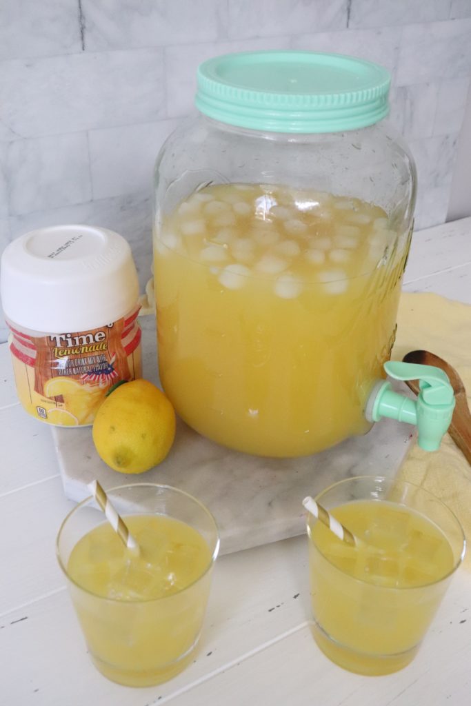 2 glasses of lemonade and a pitcher of lemonade