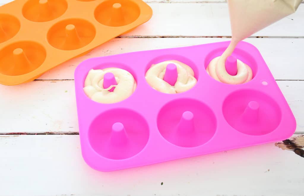 put donut batter in the donut pan