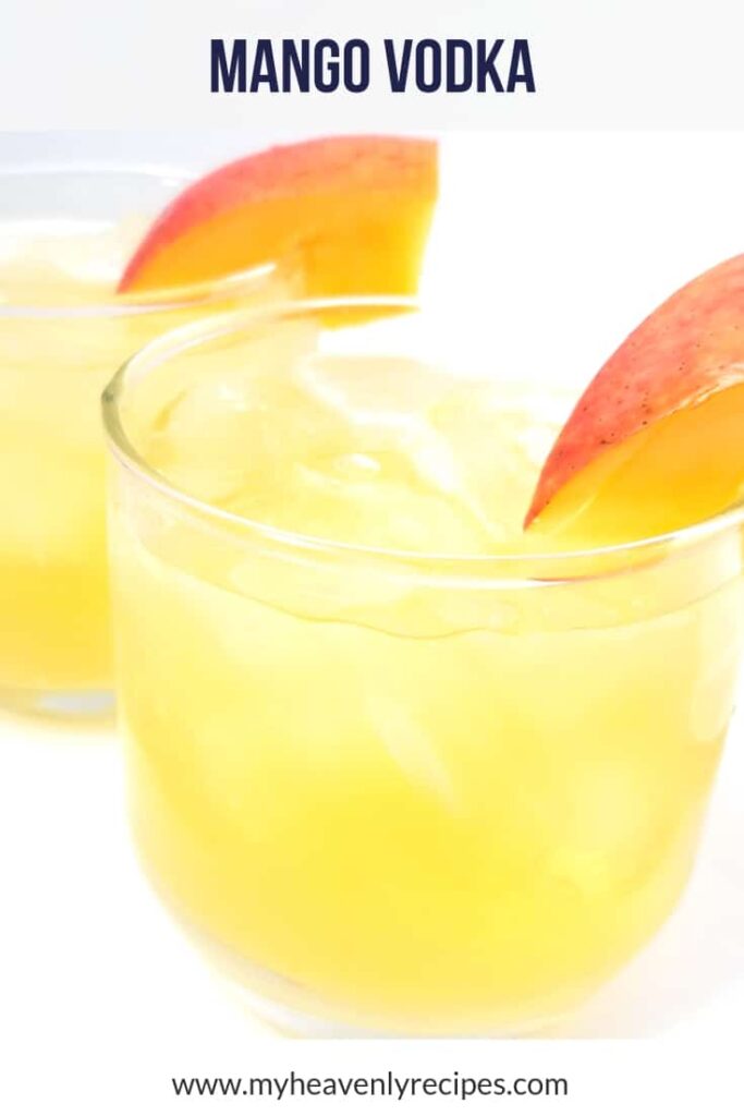 Mango vodka cocktail in glasses with mango slice