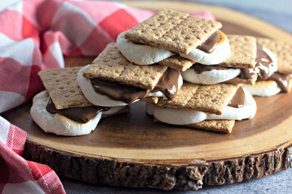Oven Baked Smores on a slice of wood