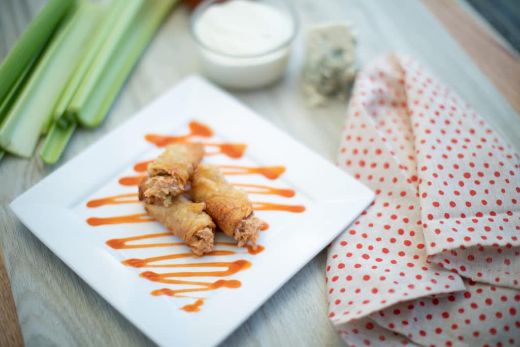 baked buffalo chicken thigh bites on a plate