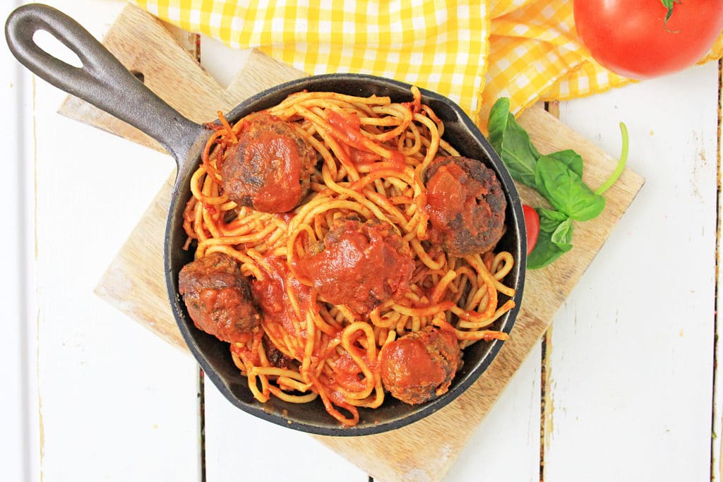 Pressure Cooker Spaghetti and Meatballs in a cast iron skillet
