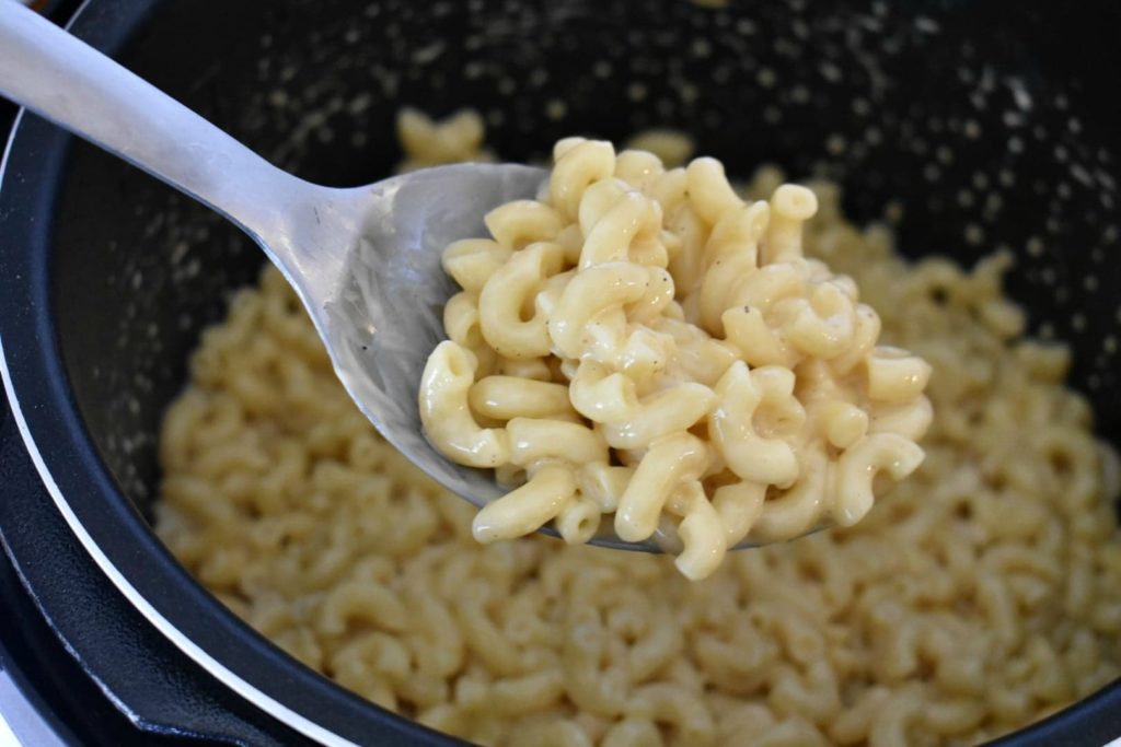 spoon of macaroni and cheese in the instant pot