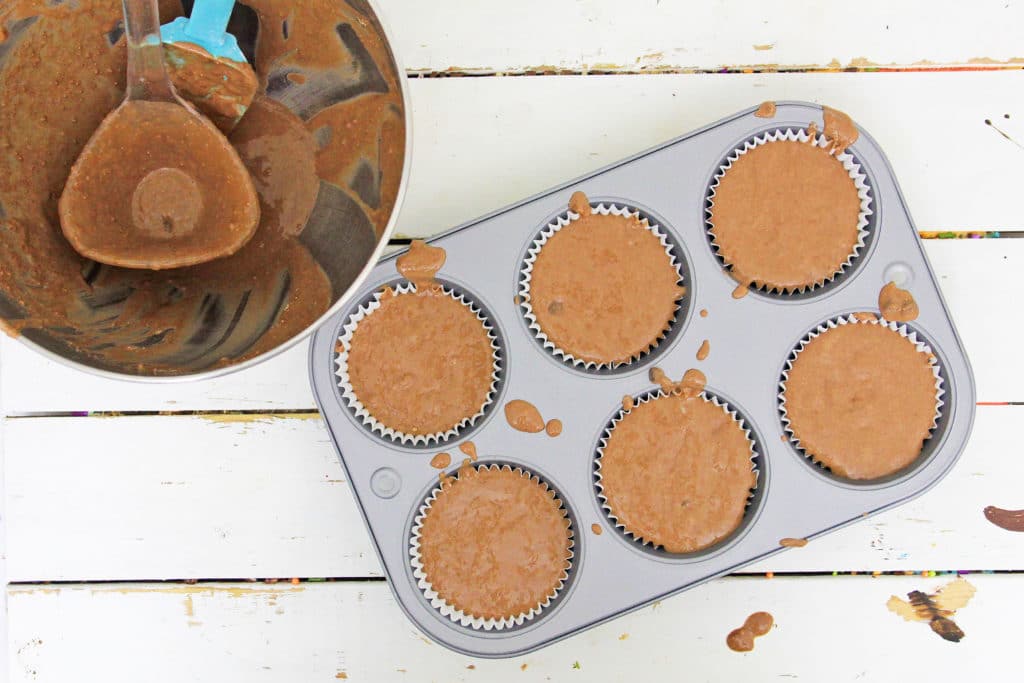 muffin batter in muffin tins