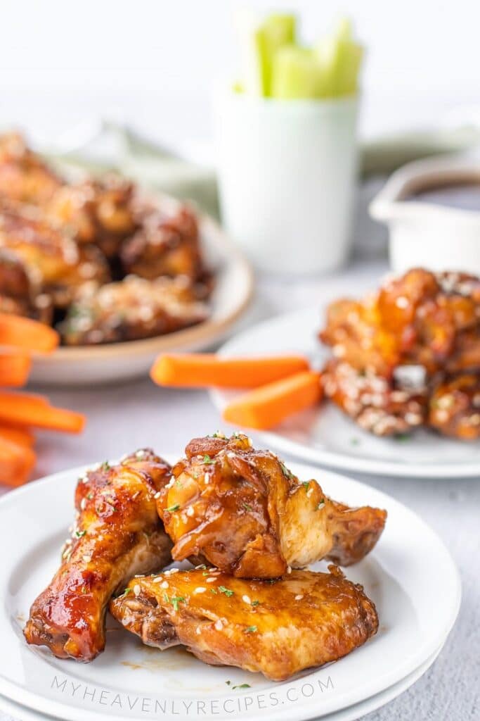 teriyaki chicken wings on white plate