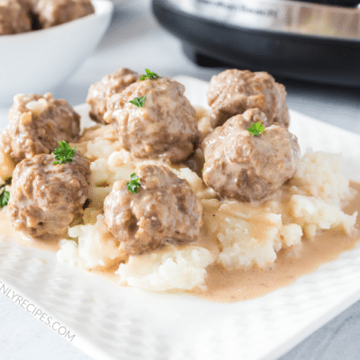 swedish meatballs on plate of mashed potatoes