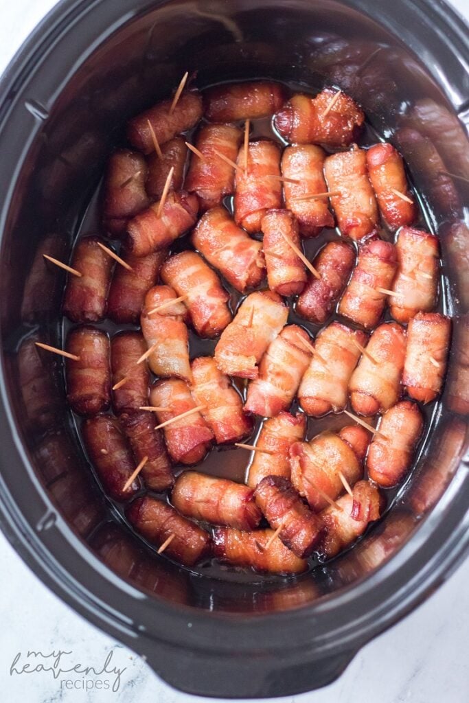 https://myheavenlyrecipes.com/wp-content/uploads/2021/12/Slow-Cooker-Bacon-Wrapped-Smokies-683x1024.jpg