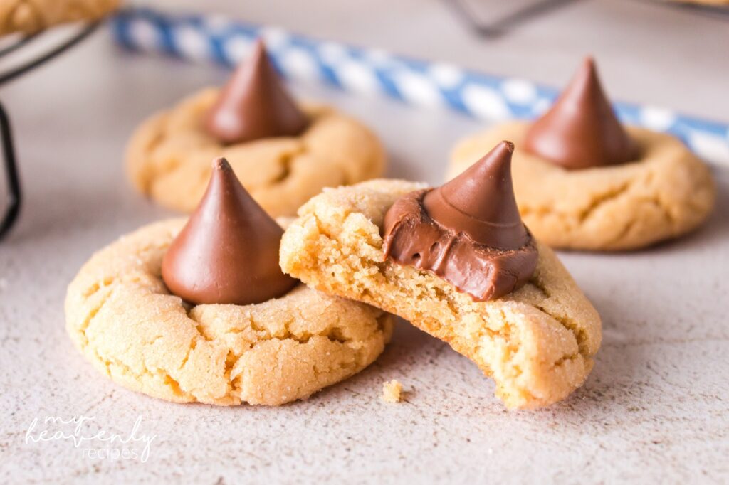 https://myheavenlyrecipes.com/wp-content/uploads/2022/12/peanut-butter-blossom-cookies-recipe-4-1024x682.jpg